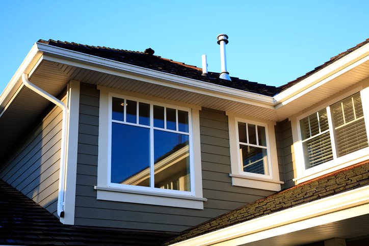 Fort Langley, British Columbia Canada- September 21,2010:  Upper portion of new modern home. Showing all the features such as siding,roof,soffits,gutter,drain spout and windows.